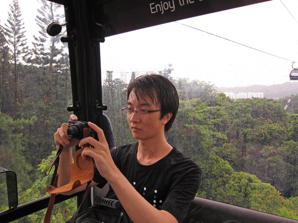 Cheng Photographs in a Rainy Gondola
